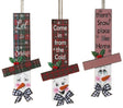 Hanging sign designed to look like a snowman head. One snowman has a red and green buffalo check top hat that reads "Let It Snow." One snowman has a red and green plaid top hat that reads "Come in from the Cold." One snowman has a red and white plaid top hat that reads "There's Snow place like Home."
