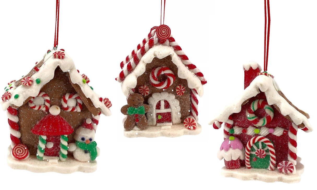 Ornaments shaped like gingerbread houses decorated with sugar, frosting, peppermint candies, gummy candies and candy canes.
