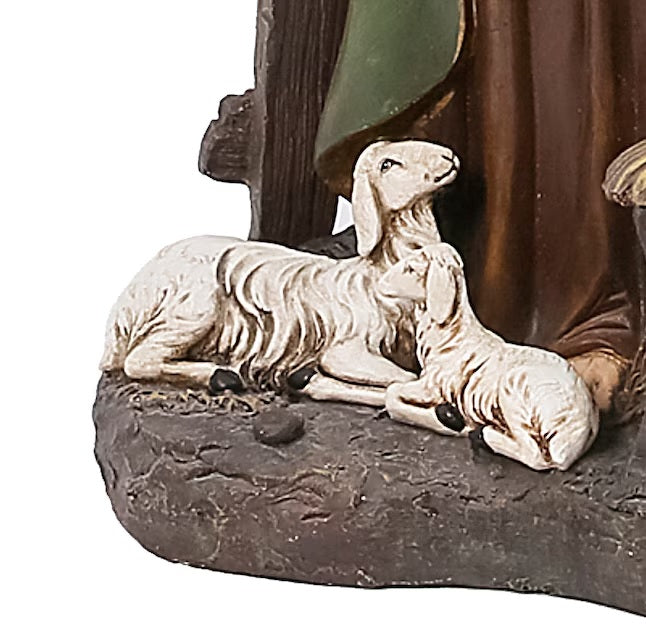 Lighted Nativity Scene featuring Mary, Joseph and Jesus surrounded by sleeping barn animals. Joseph is holding a lantern that lights up.