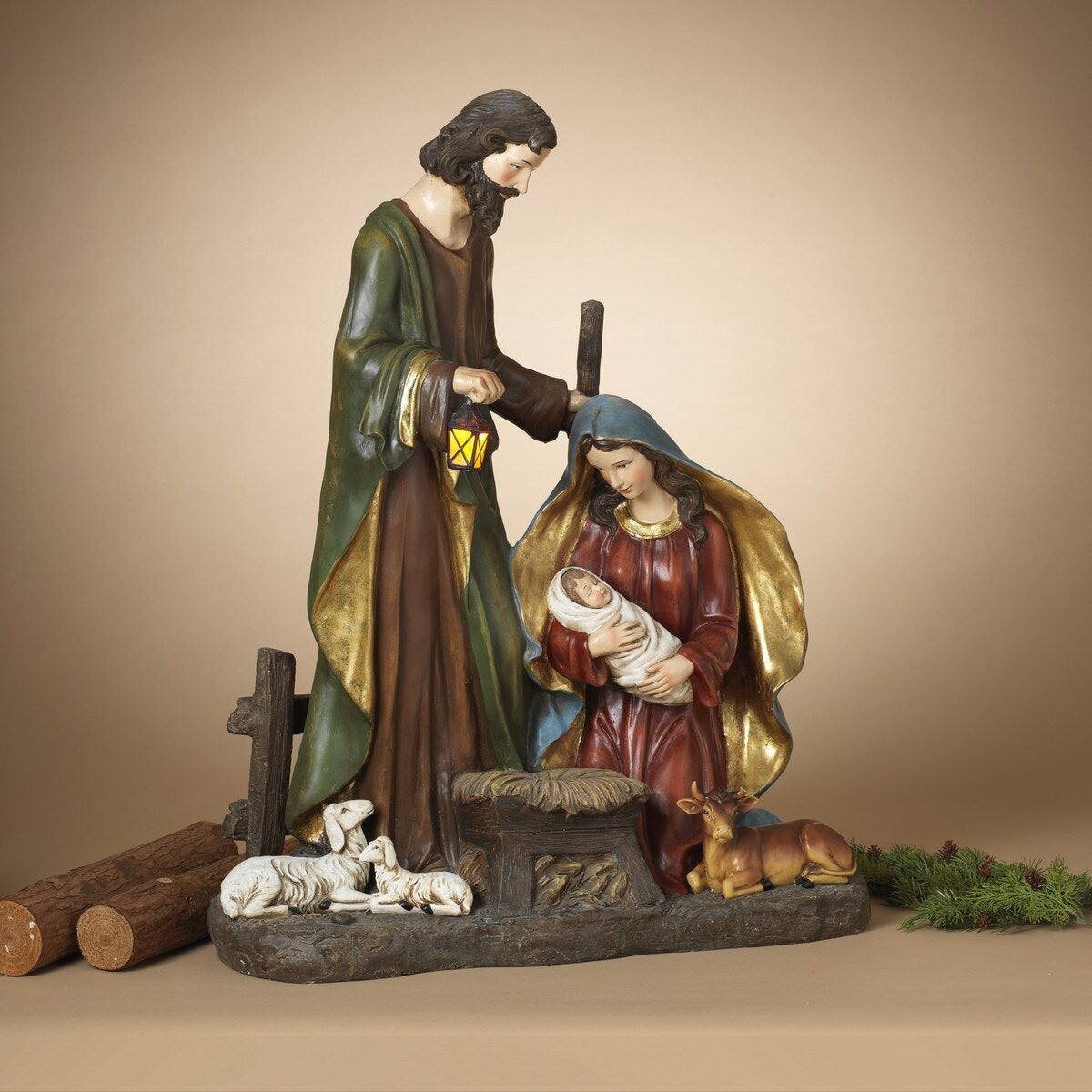 Lighted Nativity Scene featuring Mary, Joseph and Jesus surrounded by sleeping barn animals. Joseph is holding a lantern that lights up.