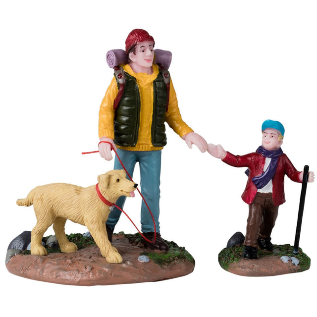 Resin figurines for a Lemax Village display. Designed to look like a man hiking with his young son and dog. The ground features dirt, bits of grass and rocks.