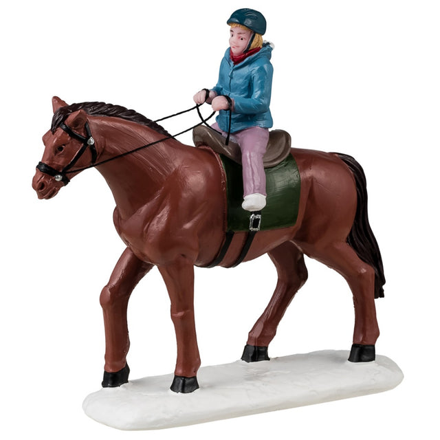 Resin figurine for a Lemax display. Designed to look like a young girl riding a brown horse. She's wearing winter clothes and a helmet.