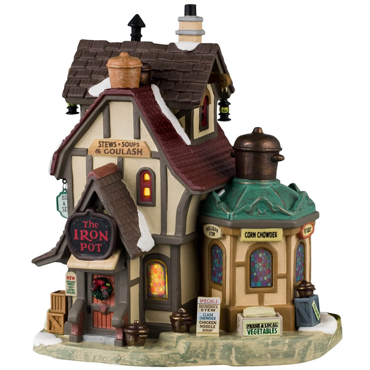Porcelain lighted building for a Lemax display. Designed to look like an old-timey building with a circular sun room off to the side. The windows are multi-colored stained glass. There are signs advertising stews, soups, goulash, Brunswick stew, clam chowder, chicken noodle soup, vegetables and potatoes. There's also a sign that reads "New Holiday Menu and Later Hours!" There's snow on the roof and the sidewalk.