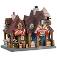Porcelain lighted building for a Lemax display. Designed to look like a renaissance cottage with different shops. Get a turkey leg at Tom's. Buy a helmet that's on sale at the armory. Get hand-crafted jewelry and wooden swords. Tom's Turkey Legs is a light green color. The other shops are a light blue color.