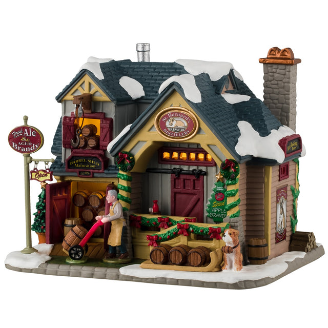 Porcelain lighted building for a Lemax display. Designed to look like a brewery with snow on the roof. There are garland and wreath accents. There are barrels everywhere and a man pushing a cart with a barrel inside. There's a St. Bernard dog standing watch in front.