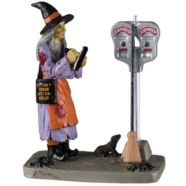 Resin figurine for a Lemax display. Designed to look like a witch meter maid writing a ticket.