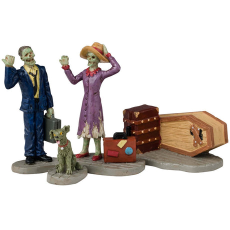 Resin figurines for a Lemax display. Designed to look like two monsters hitchhiking. They have a dog, two suitcases and a coffin.