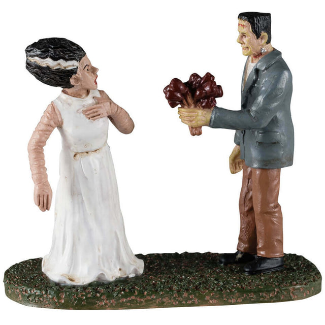 Resin figurine for a Lemax display. Designed to look like Frankenstein handing his bride a bouquet of flowers.