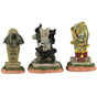 Resin village accents for a Lemax display. Designed to look like three headstones. One has a bat statue on it and it reads "Vlad Vampyr 1452-?" The next one is shaped like a cat and reads "RIP Miss Kitty aka Crazy Cat Lady." There are black cats on it. The next one features a skull with snakes coming out of it and a bunch of red candles lit at the base.
