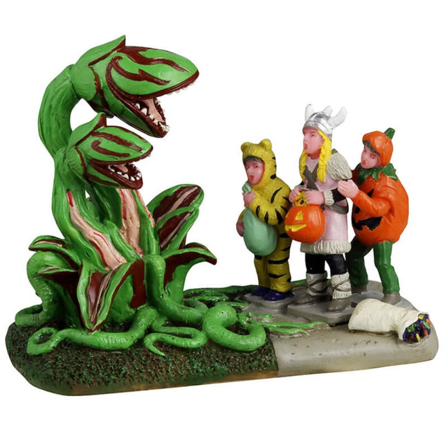 Resin figurine for a Lemax display. Designed to look like three trick or treaters getting scared by Venus fly traps that have come to life. One is dressed as a tiger, one is dressed as a Viking and the other is dressed as a pumpkin.