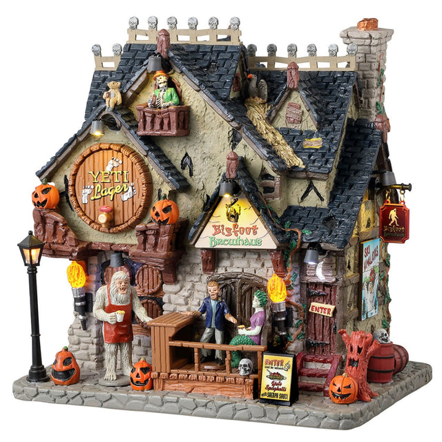 Resin lighted building for a Spooky Town display. Designed to look like a brewery with pumpkin accents everywhere. There are monsters all over, drinking.