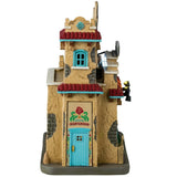 Resin lighted building for a Lemax display. Designed to look like a Spanish colonial building decorated for Day of the Dead. There are sugar skull accents and candles and flowers.