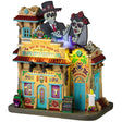 Resin lighted building for a Lemax display. Designed to look like a Spanish colonial building decorated for Day of the Dead. There are sugar skull accents and candles and flowers.