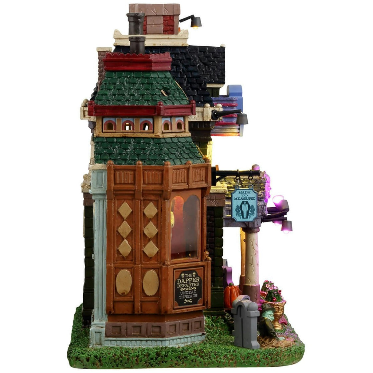 Resin lighted building for a Lemax display. Designed to look like a very colorful mortuary. There are tombstones in the front, and a zombie coming out of one of the graves. There are neon signs and inside the windows you can see zombie barbers.