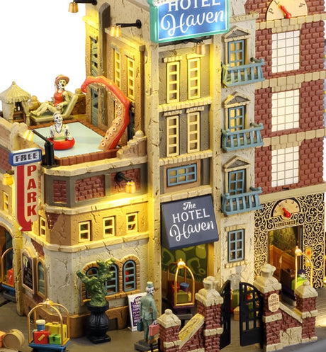Resin lighted building for a Lemax display. Designed to look like a parking garage attached to a hotel. There's a pool on top of the garage with a monster's tentacle sticking out. The right side of the hotel is designed to look like an elevator. There's luggage all over the place.
