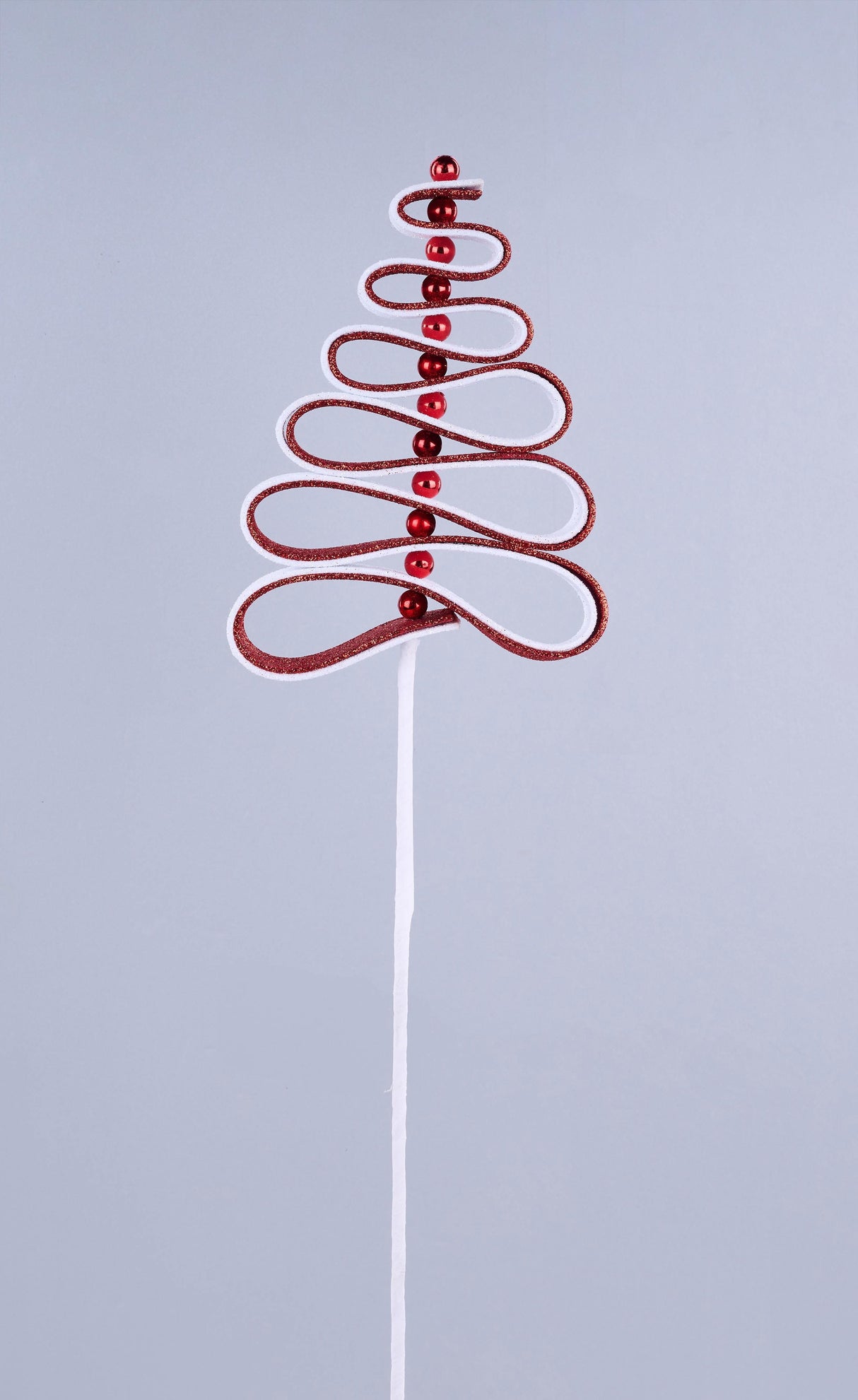 Twisty pick spray designed to look like red and white ribbon candy with metallic red baubles.