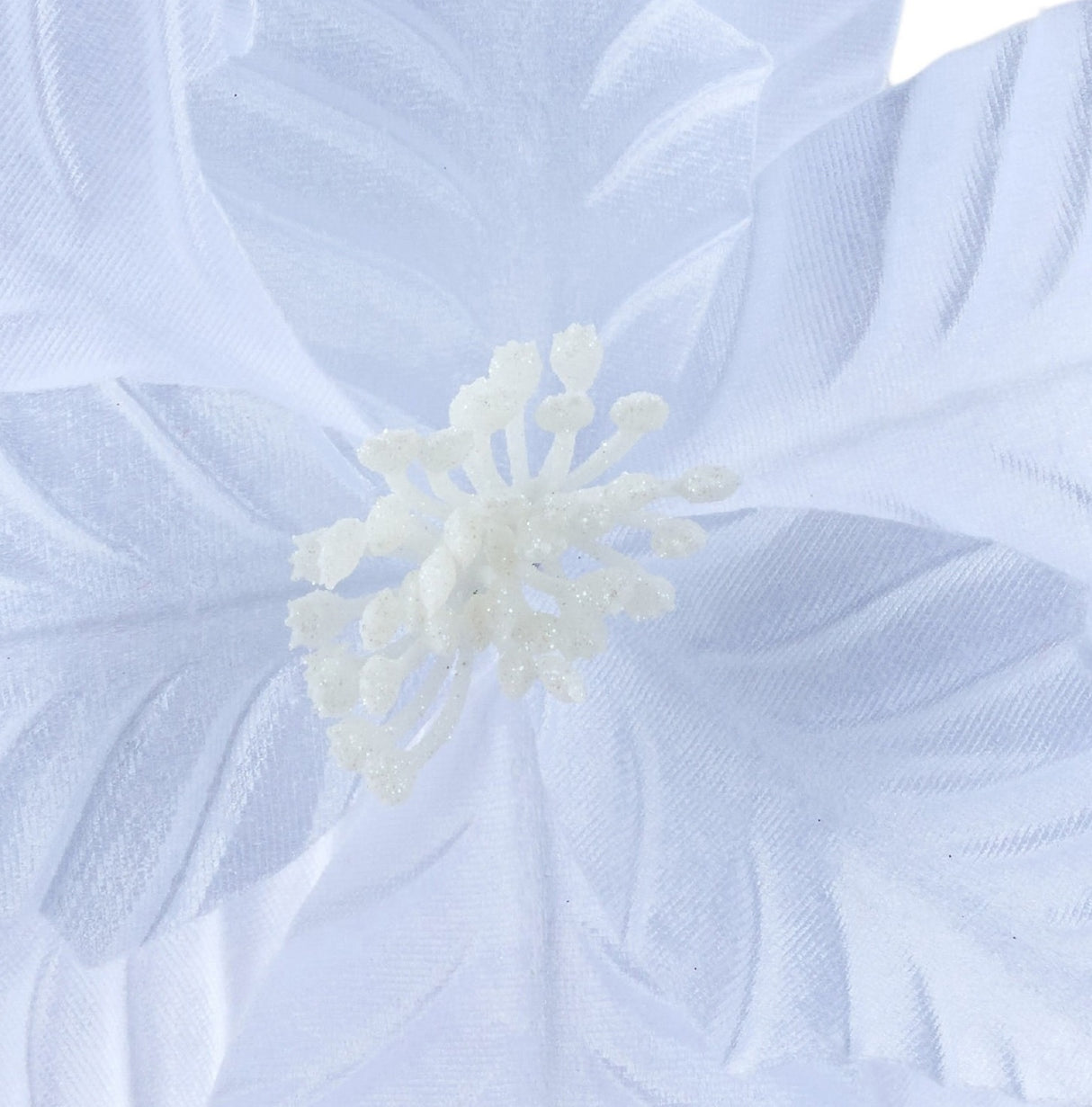 White floral pick spray shaped like a poinsettia.