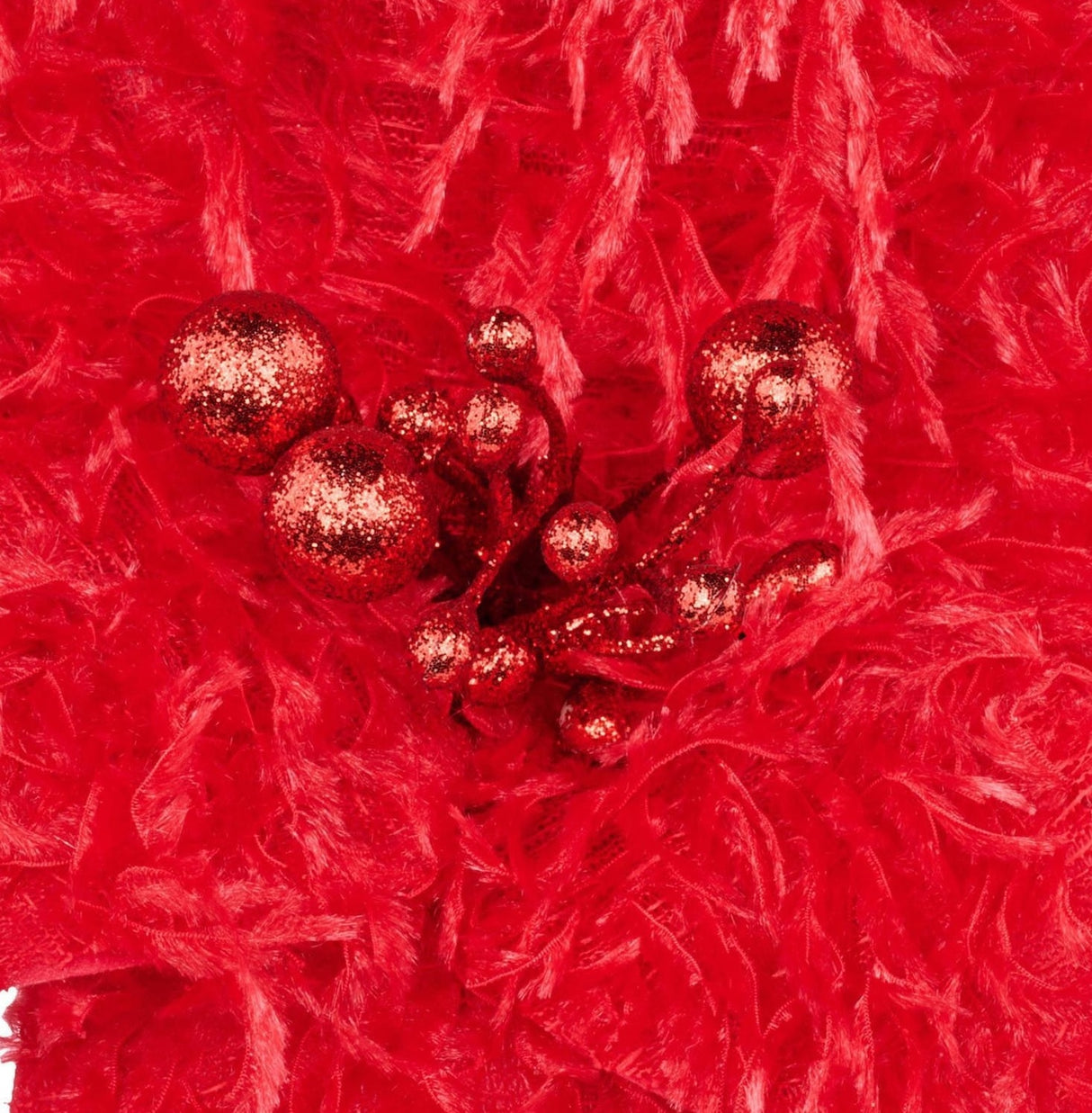 Furry red poinsettia-shaped pick spray with red glitter in the center.