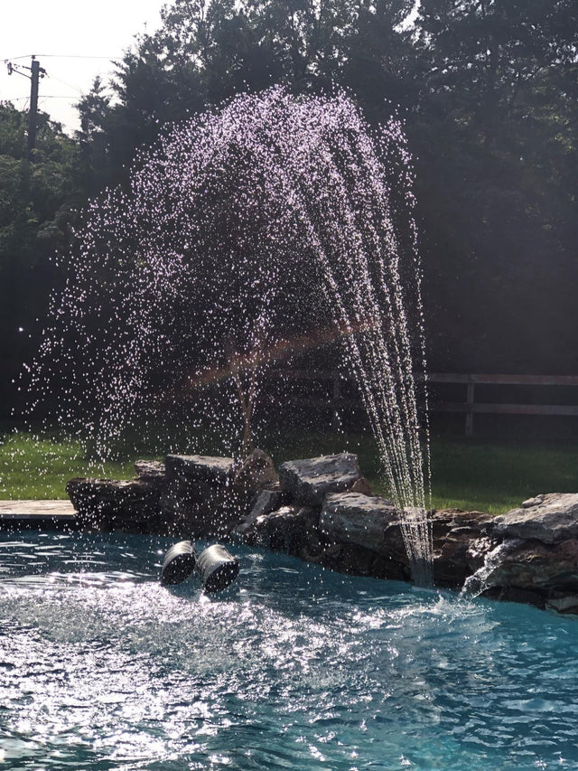 Waterfall fountain that you can add to your pool. It hooks into your pool's water return fitting. This image shows the fountain in use in an inground pool.