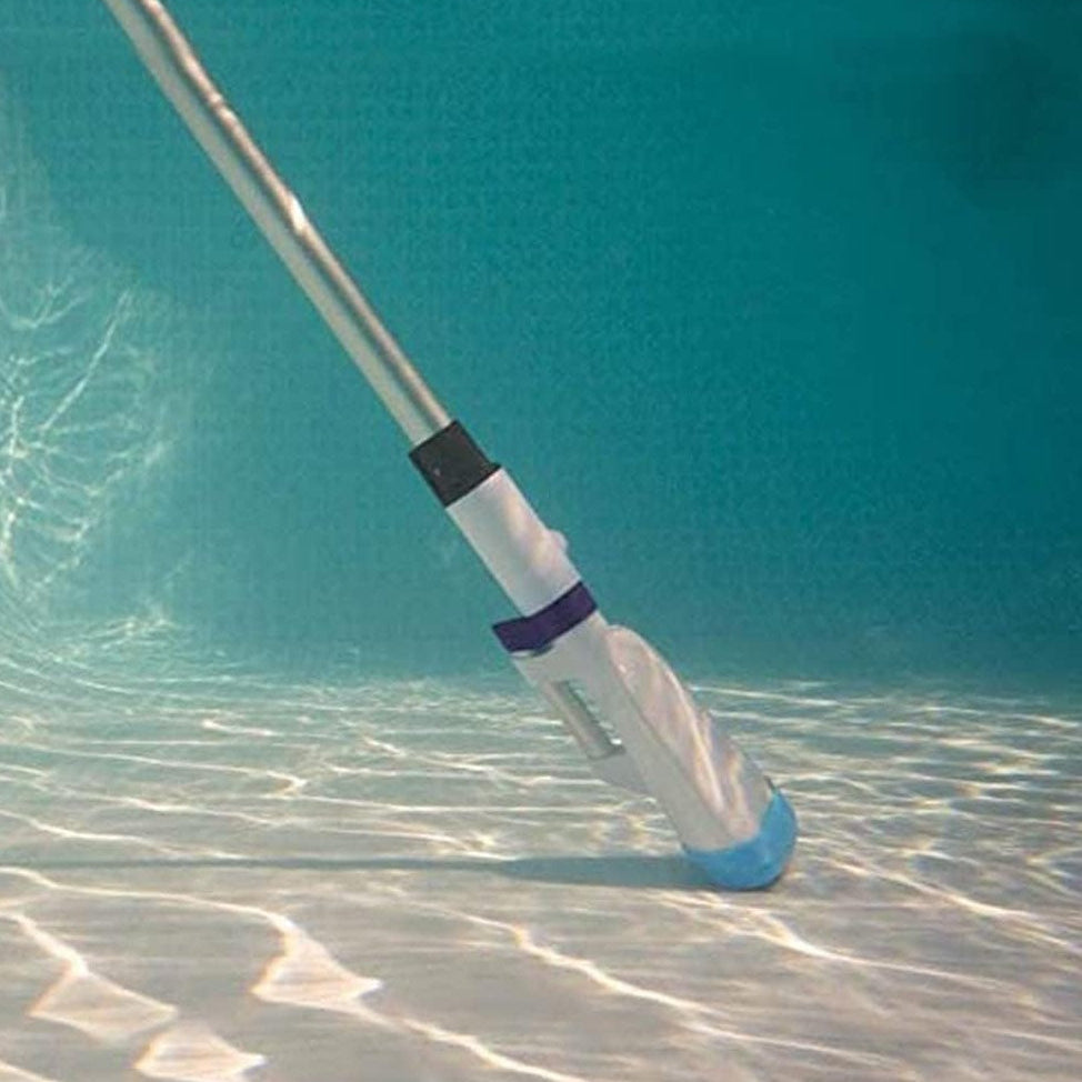 This is a lifestyle image showing the pool vacuum in use at the bottom of a pool.