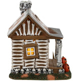 Resin village accent for a Lemax display. Designed to look like an old cabin made out of bones and skulls and wood. There are carved pumpkins on either side of the front door along with a sign that reads "KEEP OUT!"