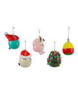 Blow mold Squishmallow ornament. One ornament is Winston the teal owl. One ornament is Cam the calico cat. One ornament is Hans the brown hedgehog. One ornament is Maui the yellow pineapple. One ornament is Brina the pink bigfoot.