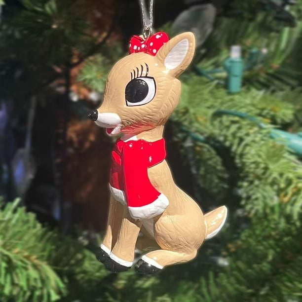 Ornaments designed to look like two of the characters from the 1964 television movie Rudolph the Red-Nosed Reindeer. One ornament is Rudolph wearing a red scarf. The other ornament is Clarice wearing a red scarf.