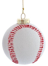 Ornament shaped like a baseball decorated with white glitter and red glitter.