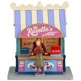 Resin village accent for a Lemax display. Designed to look like a cupcake vendor booth. It's run by Rosette and it's sweets to go. The colors of the booth are light purple, tan, pink, light blue and dark blue.