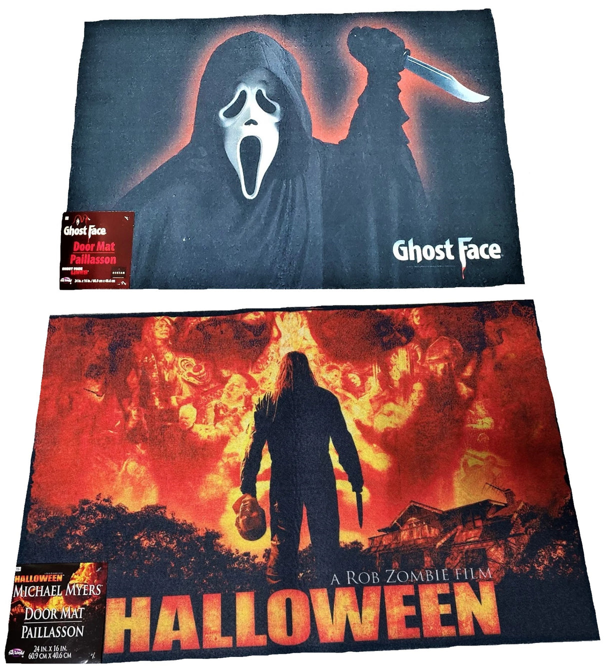 Rug for Halloween. There are two options. One is black with Ghost Face holding a knife. The other option is red and orange and reads "Halloween: A Rob Zombie Film." It has Michael Myers holding a knife in front of a home.