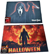 Rug for Halloween. There are two options. One is black with Ghost Face holding a knife. The other option is red and orange and reads "Halloween: A Rob Zombie Film." It has Michael Myers holding a knife in front of a home.