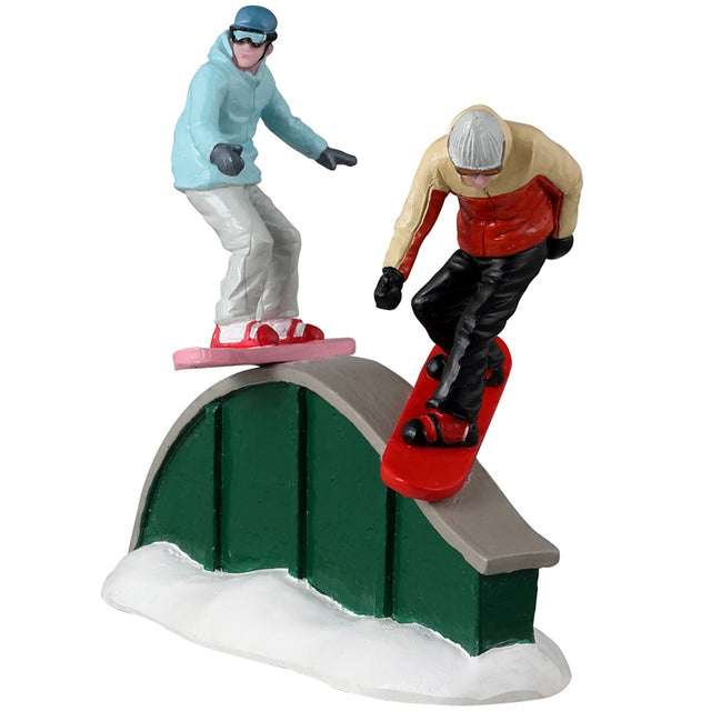 Resin figurine for a Lemax display. Designed to look like two people snowboarding on a rail.