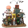Resin building for a Lemax display. Designed to look like a really weird meat packing plant. There are crows flying above. There's a large statue of a brain going into a meat grinder on the roof. There are monsters working.