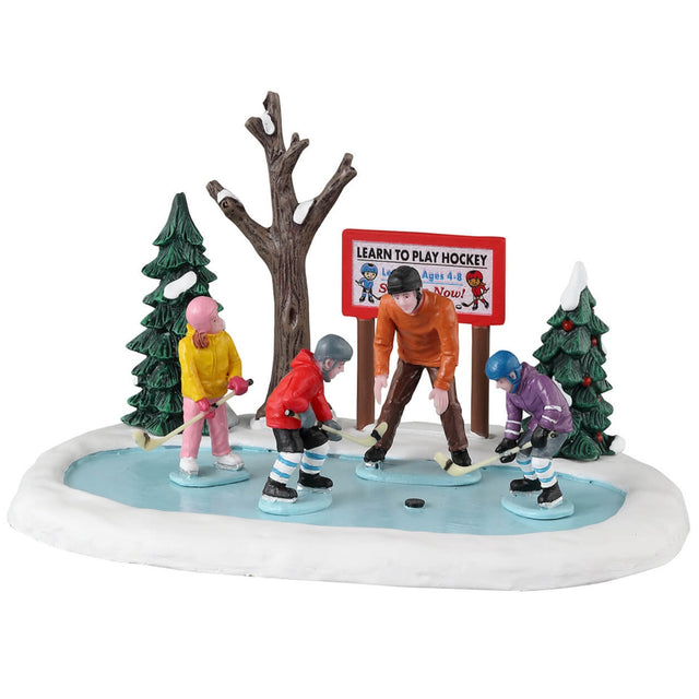 Resin village accent for a Lemax display. Designed to look like a teacher helping three kids learn how to play hockey.