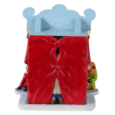 Resin village accent for a Lemax display. Designed to look like a booth decorated to look like a mini theatre with a red curtain. There are two puppets inside and four kids watching.
