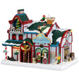 Resin lighted building for a Lemax display. Designed to look like a snow covered animal sanctuary. There are elves everywhere helping with the animals and helping to decorate a Christmas tree on the balcony.