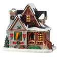 Porcelain lighted building for a Lemax display. Designed to look like a snow-covered log cabin. There are decorated wreaths, garland and Christmas trees. There's also a dog wearing a Santa hat near the front porch.