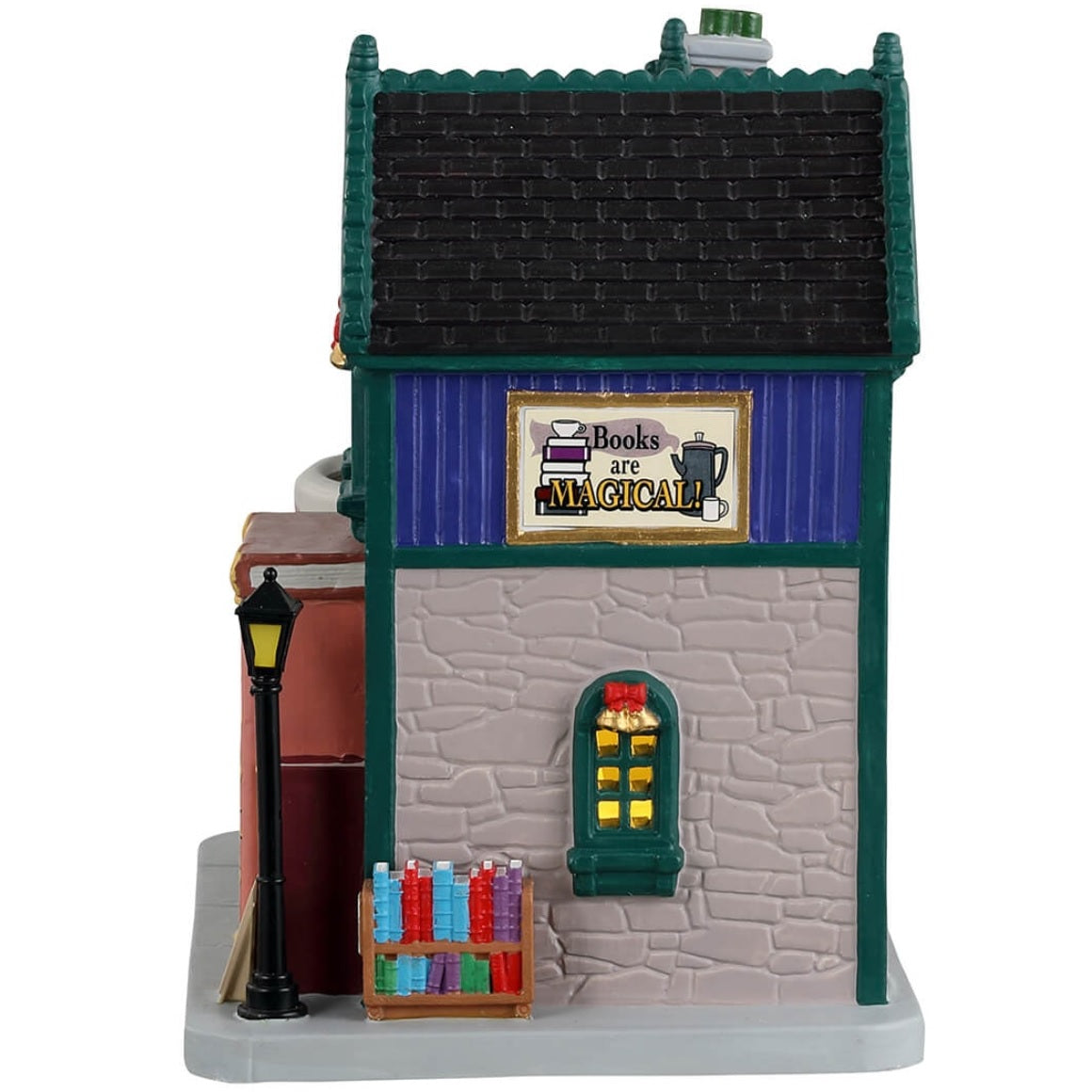 Porcelain lighted building for a Lemax display. Designed to look like a blue book store that also sells coffee. The front door's frame is made to look like it's made out of books. The booth to the right looks like it's made out of a white mug. The building is decorated for Christmas.