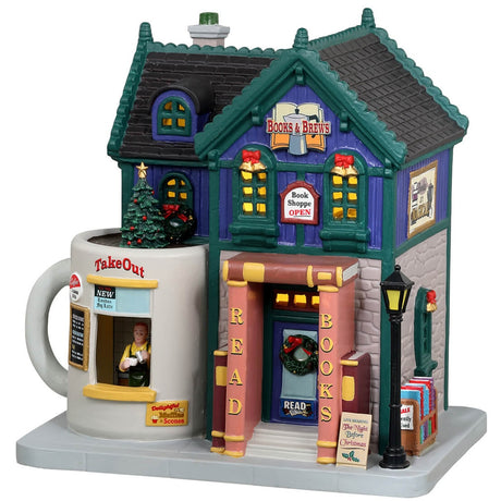 Porcelain lighted building for a Lemax display. Designed to look like a blue book store that also sells coffee. The front door's frame is made to look like it's made out of books. The booth to the right looks like it's made out of a white mug. The building is decorated for Christmas.