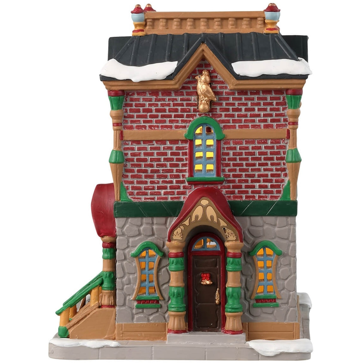 Porcelain lighted building for a Lemax display. Designed to look like a brick building decorated for Christmas with wreaths and garlands. There's snow on the roof and on the sidewalk. 