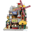 Plastic lighted building for a Lemax display. Designed to look like a large muffin shop. There's a large red windmill with a large muffin statue on the roof. The windmill reads "BANANA, CINNAMON, CHOCOLATE, BLUEBERRY."