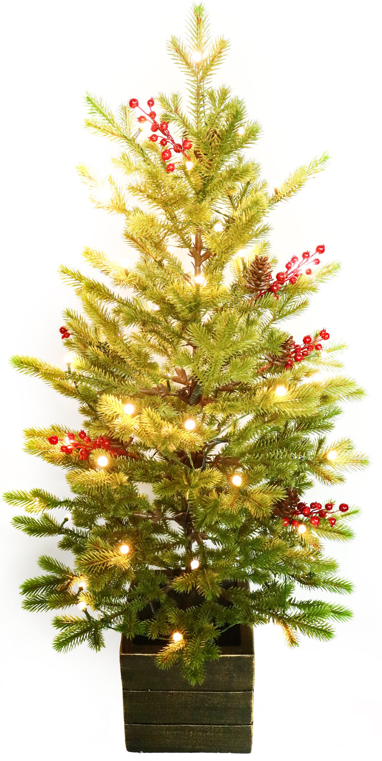 Artificial tree pre-lit with Starry lights. Tree is decorated with red berries and is in a pot.