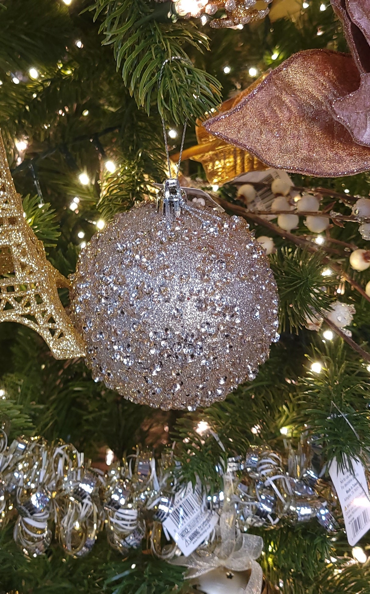 Taupe colored glittery ornament.