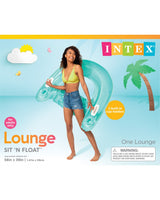 This image shows the Intex packaging this lounge float comes in. On the box is a lifestyle image showing a woman holding the blue Sit n Float Pool Lounge. The background is designed to look like it's been made out of colored paper. There's a white cloud in the sky, hiding the sun. There are two butterflies and a palm tree.