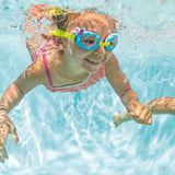 This is a lifestyle image showing a young girl underwater wearing the butterfly goggles.