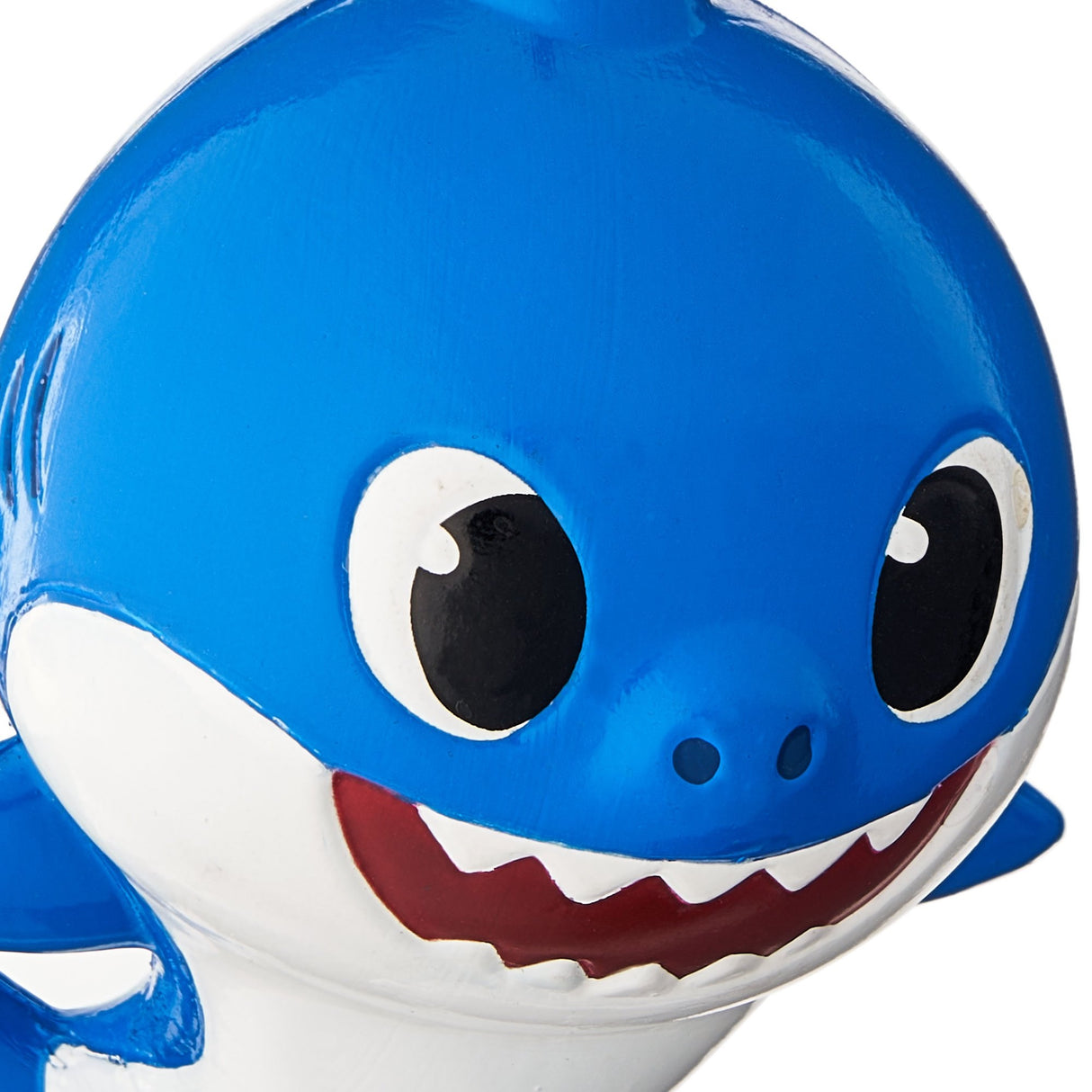 Baby Shark themed ornaments. Baby Shark is yellow. Mommy Shark is pink. Daddy Shark is blue.
