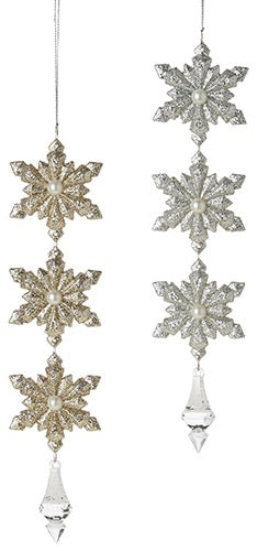 Snowflake drop ornaments. One is gold and the other is silver.