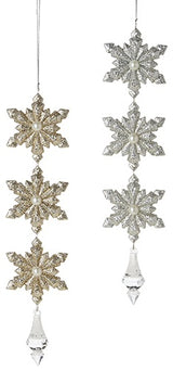 Snowflake drop ornaments. One is gold and the other is silver.