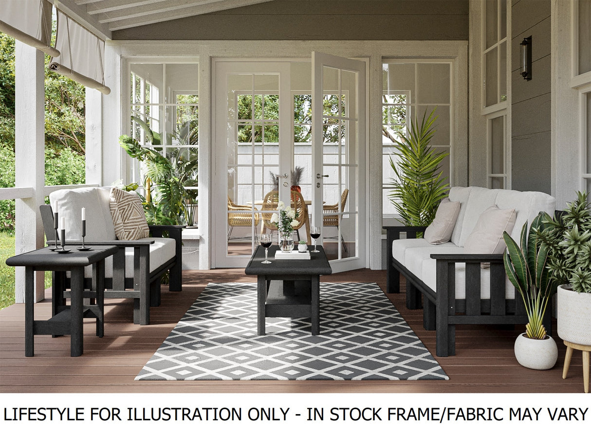 Black frame patio furniture with white cushions on an outdoor patio