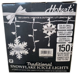 This image shows the back of the box that these lights come in. The box reads "Hofert's since 1880. 150 lights. Indoor & outdoor use. Lit length is 9 ft. Features six small snowflakes, three large snowflakes and eleven icicle drops. 150 clear bulbs on a white wire. Connect sets end-to-end. Traditional snowflake icicle lights." It also shows that the large snowflakes measure 7.875 inches in diameter and the small snowflakes measure 5 inches in diameter.